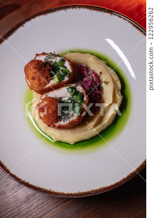 Delicious cutlets with airy mashed potatoes served 122956262