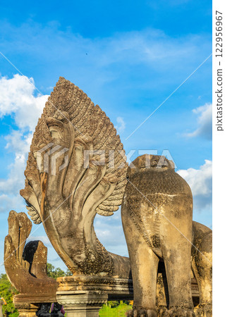 Majestic Naga stone guardian of Angkor Wat, The Serpent of Khmer Legends, Siem Reap Majestic Naga stone guardian of Angkor Wat, The Serpent of Khmer Legends, Siem Reap 122956967