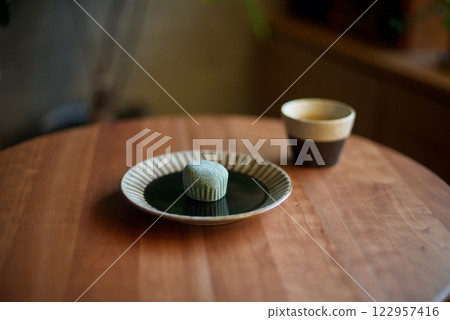 Snack of mugwort mochi and tea Snack of mugwort mochi and tea 122957416