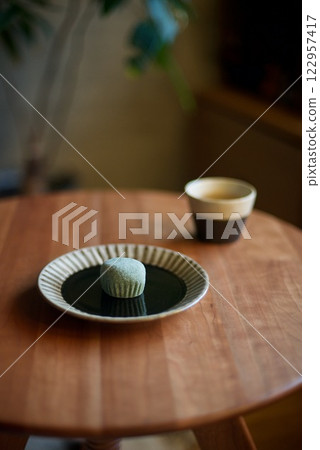 Snack of mugwort mochi and tea Snack of mugwort mochi and tea 122957417