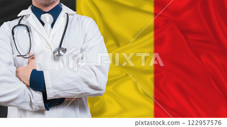 Male doctor with stethoscope on Belgium flag. Doctor holding stethoscope on Belgium flag Male doctor with stethoscope on Belgium flag. Doctor holding stethoscope on Belgium flag 122957576
