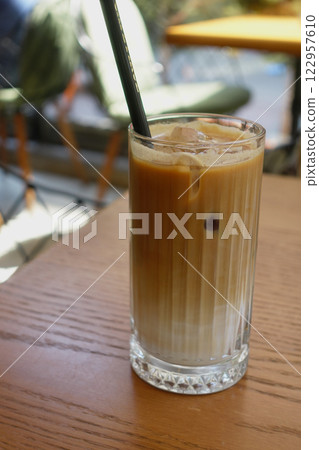 Enjoy a Refreshing Iced Coffee, complete with Ice Cubes in a Clear Glass for your delight Enjoy a Refreshing Iced Coffee, complete with Ice Cubes in a Clear Glass for your delight 122957610