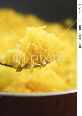 Delicious saffron rice dish being prepared in a kitchen 122957681