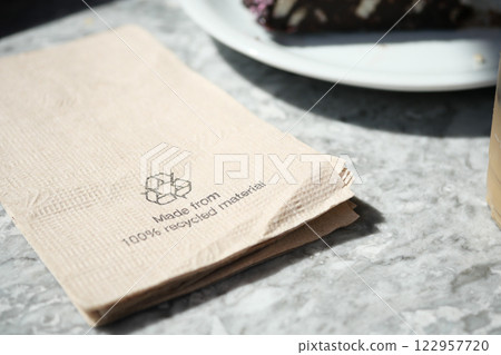Napkin made from recycled material on a marble table 122957720