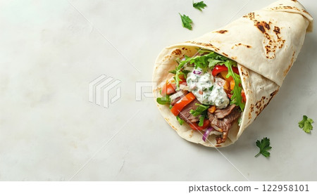 Traditional Greek Gyros: A Healthy Snack Or Lunch Option Featuring A Wrap Filled With Vegetables, Beef, And Tzatziki Sauce. Top View With Copy Space. 122958101