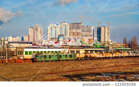 Old Soviet electric locomotive with an oil tanker train at Darnytsia station in Kyiv, the capital of Ukraine Old Soviet electric locomotive with an oil tanker train at Darnytsia station in Kyiv, the capital of Ukraine 122959599