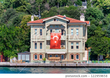 Green mountains of the Asian side of Bosphorus strait, with traditional house and dense trees in a summer day 122959658