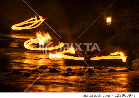 Fire fishing, traditional fishing method for sweetfish on the clear stream of Maze River, Maze, Gero City, Gifu Prefecture 122960972