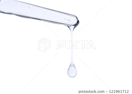 Pipette with delicate blue serum close-up. 122961712