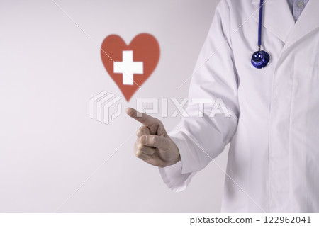 Doctor and a white cross in a red heart - medical image Doctor and a white cross in a red heart - medical image 122962041