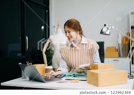 Fashion blogger concept, Young Asian women selling clothes on video streaming.Startup small business SME Fashion blogger concept, Young Asian women selling clothes on video streaming.Startup small business SME 122962369