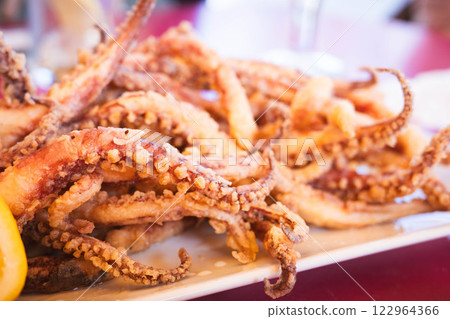 Crispy Fried Octopus Served on a Platter 122964366