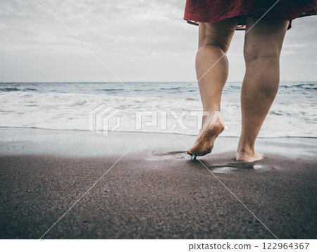 Barefoot Serenity: Walking Along the Shoreline Bliss 122964367