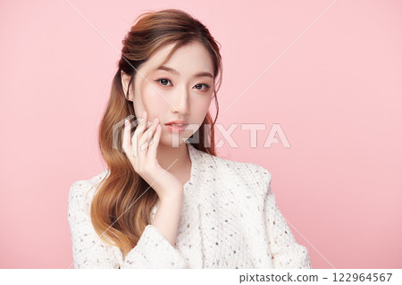 Beautiful young asian woman with clean fresh skin on pink background, Face care, Facial treatment, Cosmetology, beauty and spa, Asian women portrait. 122964567