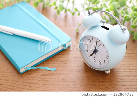 Clock and notebook schedule image Clock and notebook schedule image 122964752