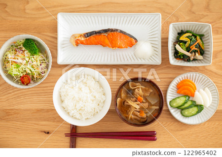 A Japanese breakfast featuring grilled salmon A Japanese breakfast featuring grilled salmon 122965402