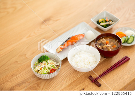 A Japanese breakfast featuring grilled salmon A Japanese breakfast featuring grilled salmon 122965415