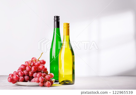 A delectable arrangement of various wine and grapes 122965539