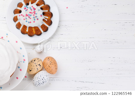 Traditional Easter cake decorated with colorful icing and sprinkles, symbolizing the festive spirit 122965546