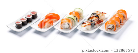 Assorted sushi and maki rolls beautifully arranged on plates Assorted sushi and maki rolls beautifully arranged on plates 122965578