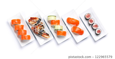 Assorted sushi and maki rolls beautifully arranged on plates 122965579