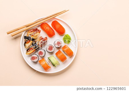 Assorted sushi and maki rolls beautifully arranged on plate Assorted sushi and maki rolls beautifully arranged on plate 122965601