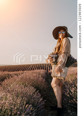 Woman in Hat Posing in Lavender Field Woman in Hat Posing in Lavender Field 122965609