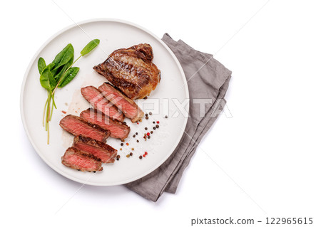 A perfectly cooked sliced striploin steak with a juicy, tender texture 122965615