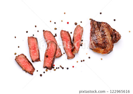 A perfectly cooked sliced striploin steak with a juicy, tender texture A perfectly cooked sliced striploin steak with a juicy, tender texture 122965616