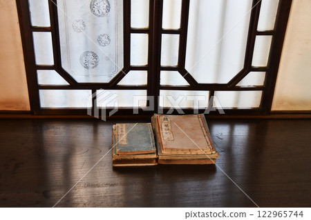 Window side of a stack of ancient documents 122965744