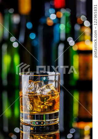 Whiskey on the rocks on a bar table 122965831