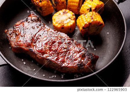 A perfectly cooked striploin steak with a juicy, tender texture 122965903