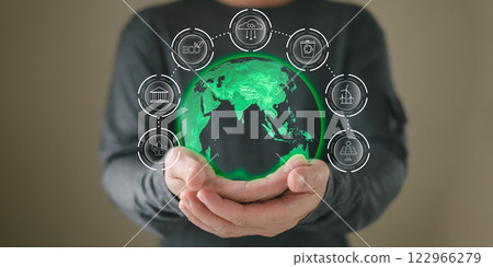 hand hold hologram to save energy,and reduce global warming,climate change,ecology friendly investment,ESG environment social governance,Green Business Innovation and Sustainable Development concept. 122966279