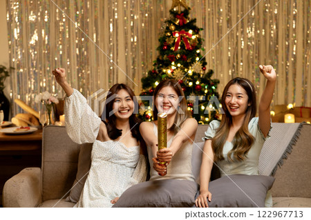 three young woman sitting in party pulling paper Shoot for fun three young woman sitting in party pulling paper Shoot for fun 122967713