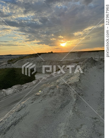 Scenic sunset over rugged sand quarry landscape 122967968