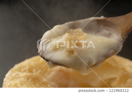 Pie stew: Lifting the pie-wrapped stew with a spoon Pie stew: Lifting the pie-wrapped stew with a spoon 122968322