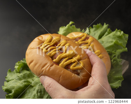 holding hot dog holding hot dog 122968444