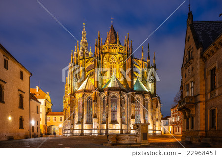 St Vitus Cathedral showcases intricate ornamental architecture illuminated at night. 122968451