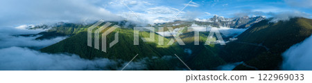 Beautiful high altitude foggy forest mountain landscape Beautiful high altitude foggy forest mountain landscape 122969033