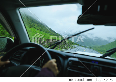 Driving car in beautiful nature 122969060