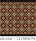 African ethnic  pattern combines the traditional Ikat style with bold geomatic designs. Featuring vibrant red tones contrasted against  ethnic a black background, it creates a visually captivating  et 122969278