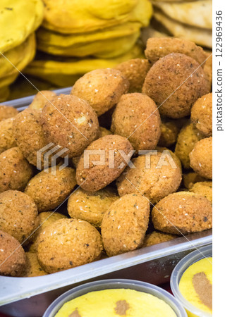 Aromatic falafel balls with chickpeas and vegetables. Vegetarian dish Aromatic falafel balls with chickpeas and vegetables. Vegetarian dish 122969436