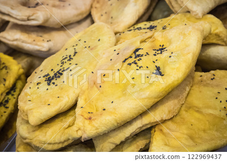 Aromatic flatbread bolani with vegetables. Traditional Afghan cuisine Aromatic flatbread bolani with vegetables. Traditional Afghan cuisine 122969437