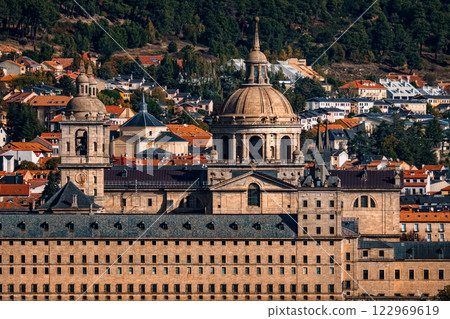 Majestic Royal Monastery of El Escorial stands proudly amidst the scenic Spanish landscape. 122969619