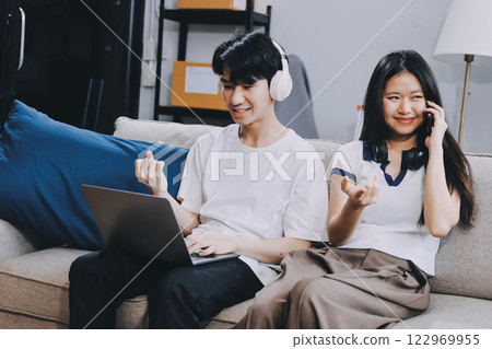 Smiling couple unpacking boxes in new house Smiling couple unpacking boxes in new house 122969955