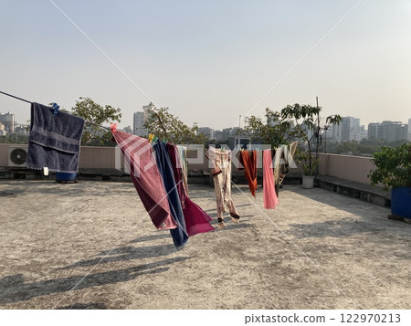 Drying laundry on the roof of an apartment building in Bangladesh Drying laundry on the roof of an apartment building in Bangladesh 122970213
