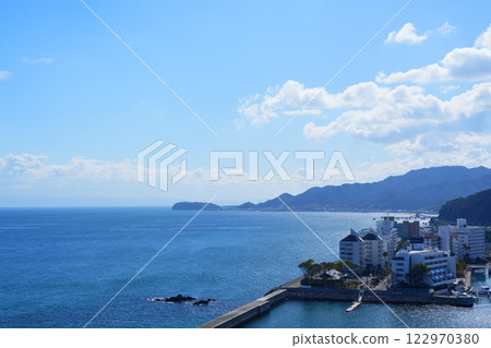 A view of a resort hotel from the rooftop of a hotel on Awaji Island, with Narugashima Island visible beyond. 122970380