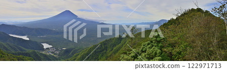 Panoramic view of Mt. Fuji and the green mountains in summer from Yoshizawayama in the Misaka Mountains 122971713