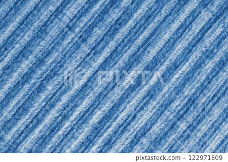 Ridge fluffy macro texture corduroy blue cloth. Large ribbed, diagonal weaving fabric background 122971809