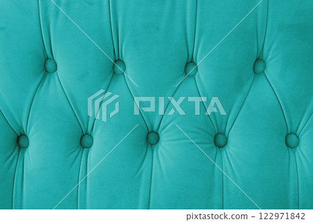 Capitone, Chesterfield style suede fabric texture, turquoise diamond buttoned turquoise background Capitone, Chesterfield style suede fabric texture, turquoise diamond buttoned turquoise background 122971842